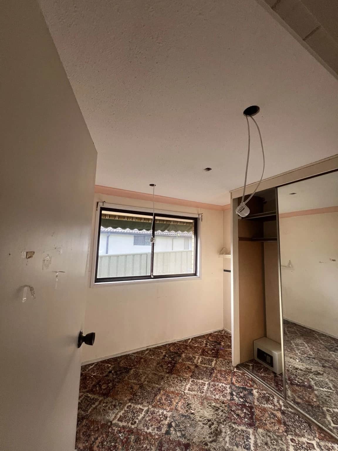 Bedroom before wall repairs and interior repainting in Baulkham Hills