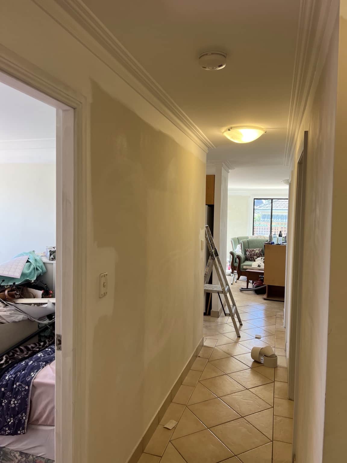 Hallway wall preparation before interior repainting in Merrylands