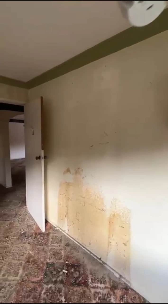 Nicotine and water-stained wall before repairs in Baulkham Hills home
