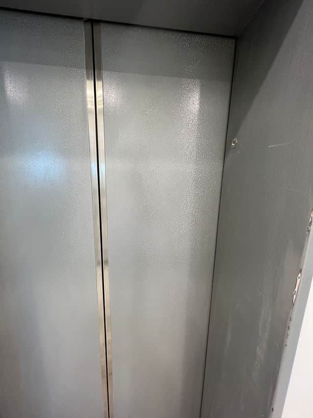 Professional lift door painting by Sky Painting & Decorating