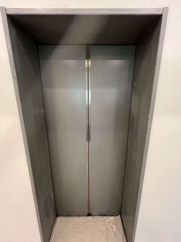 Zinsser primed and Dulux coated lift doors in Chatswood
