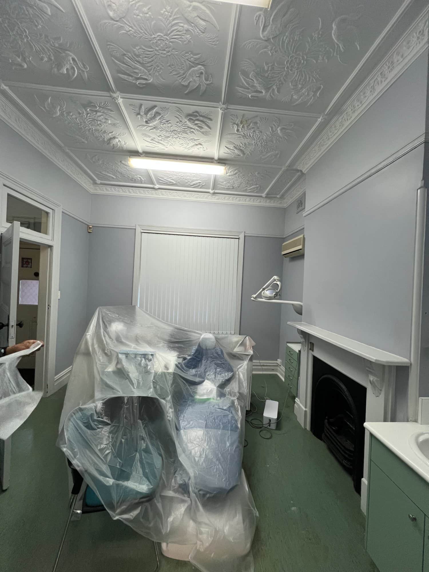 Dental treatment room protected and prepared before painting in Dulwich Hill