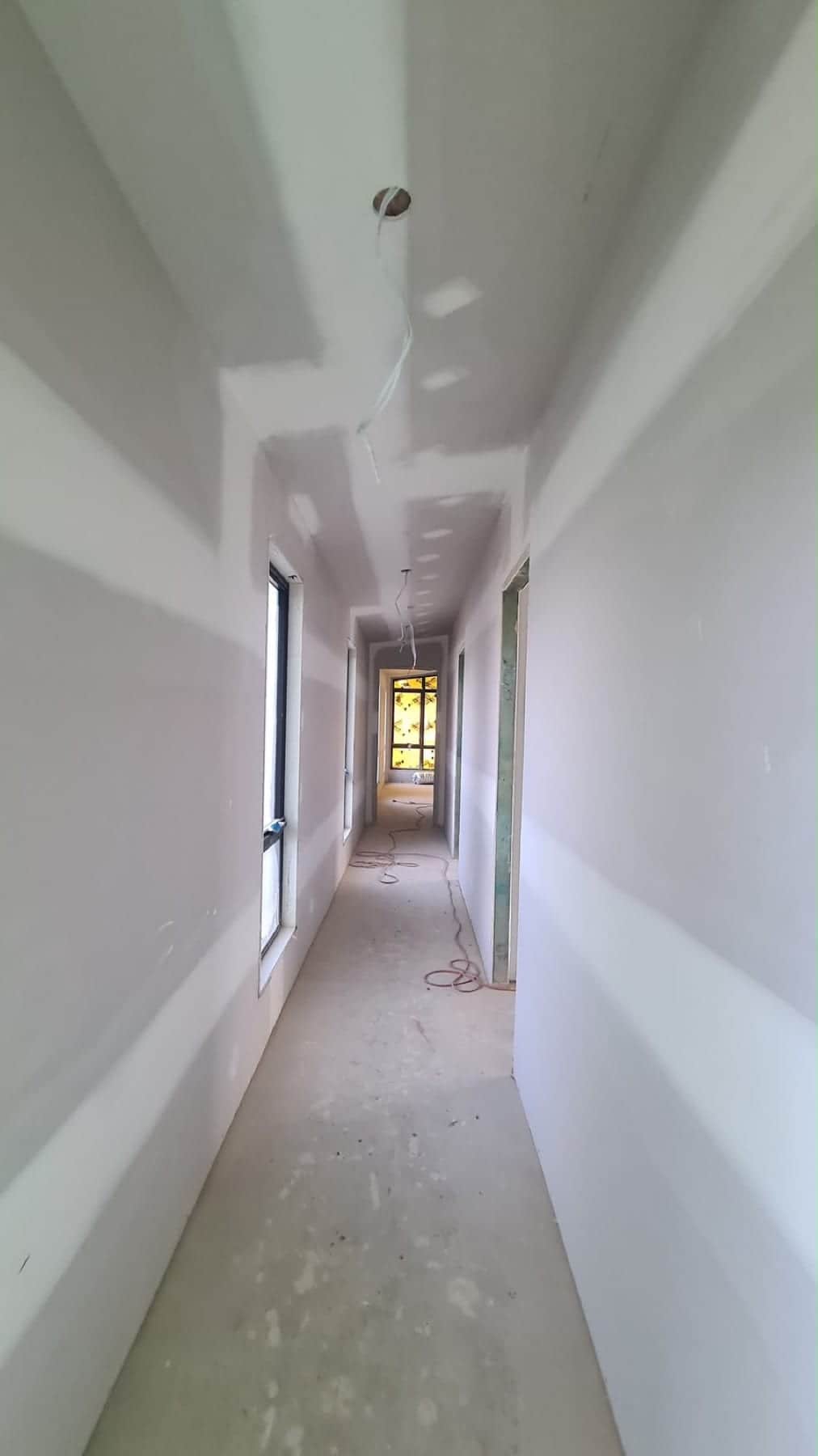 Painted hallway and corridor leading into the new-build sunroom