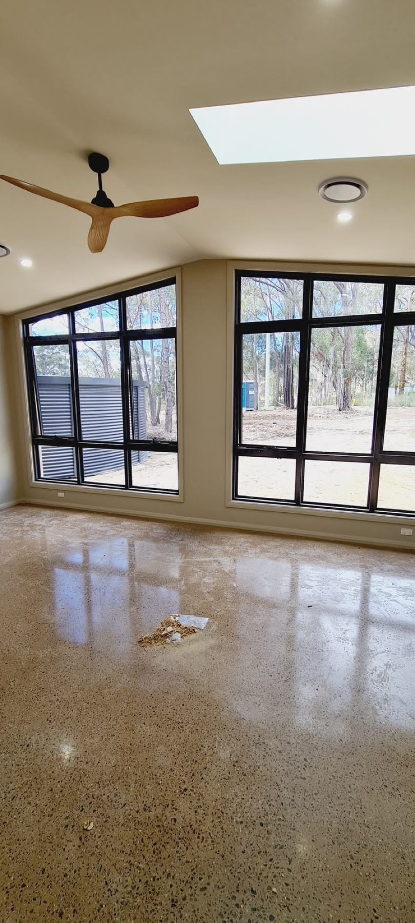 Freshly painted new-build sunroom with full-height windows, after