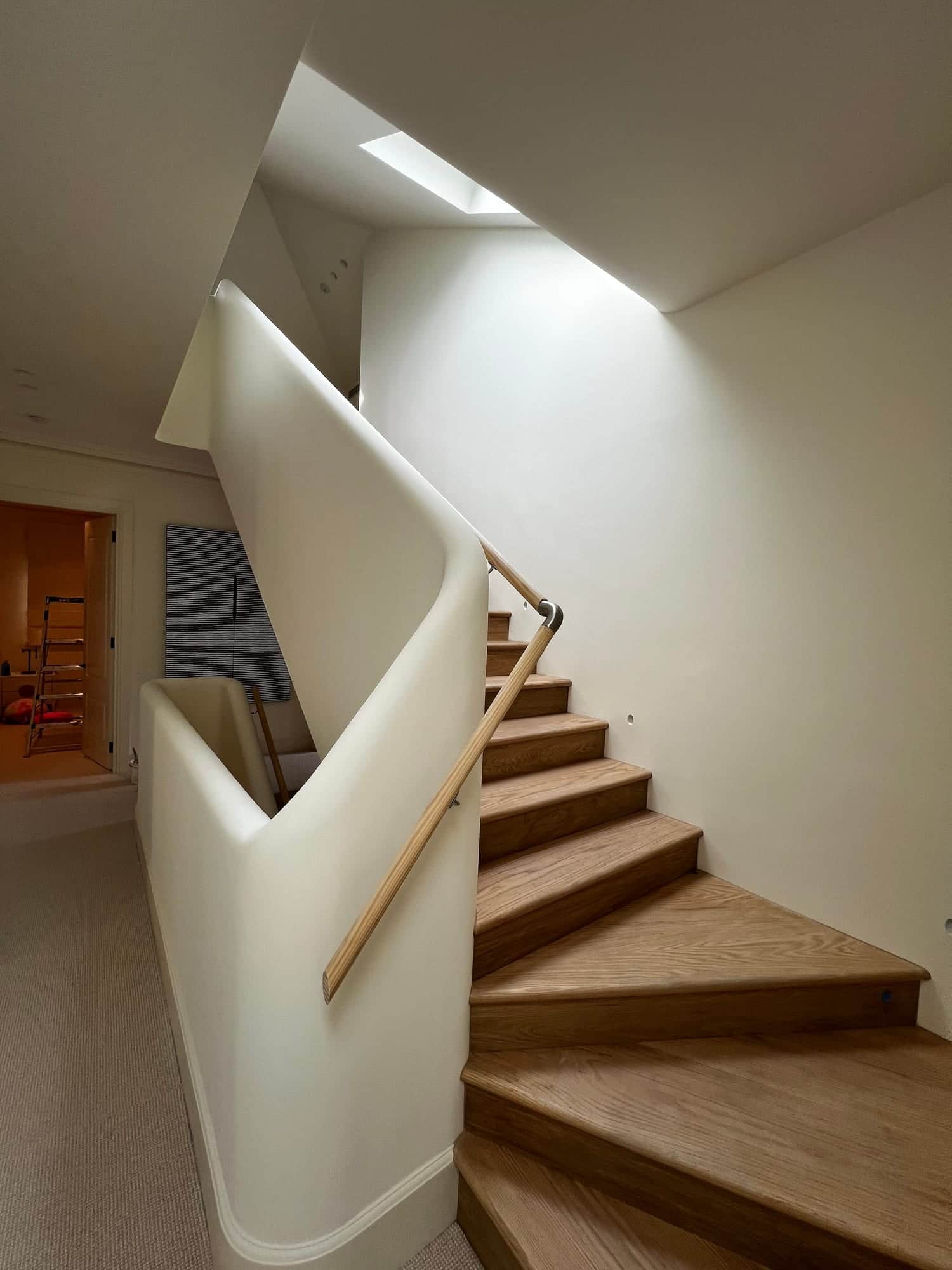 Freshly painted curved stairwell and interior walls in Sydney home